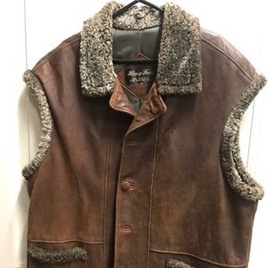 Leather vest with shearling trim
